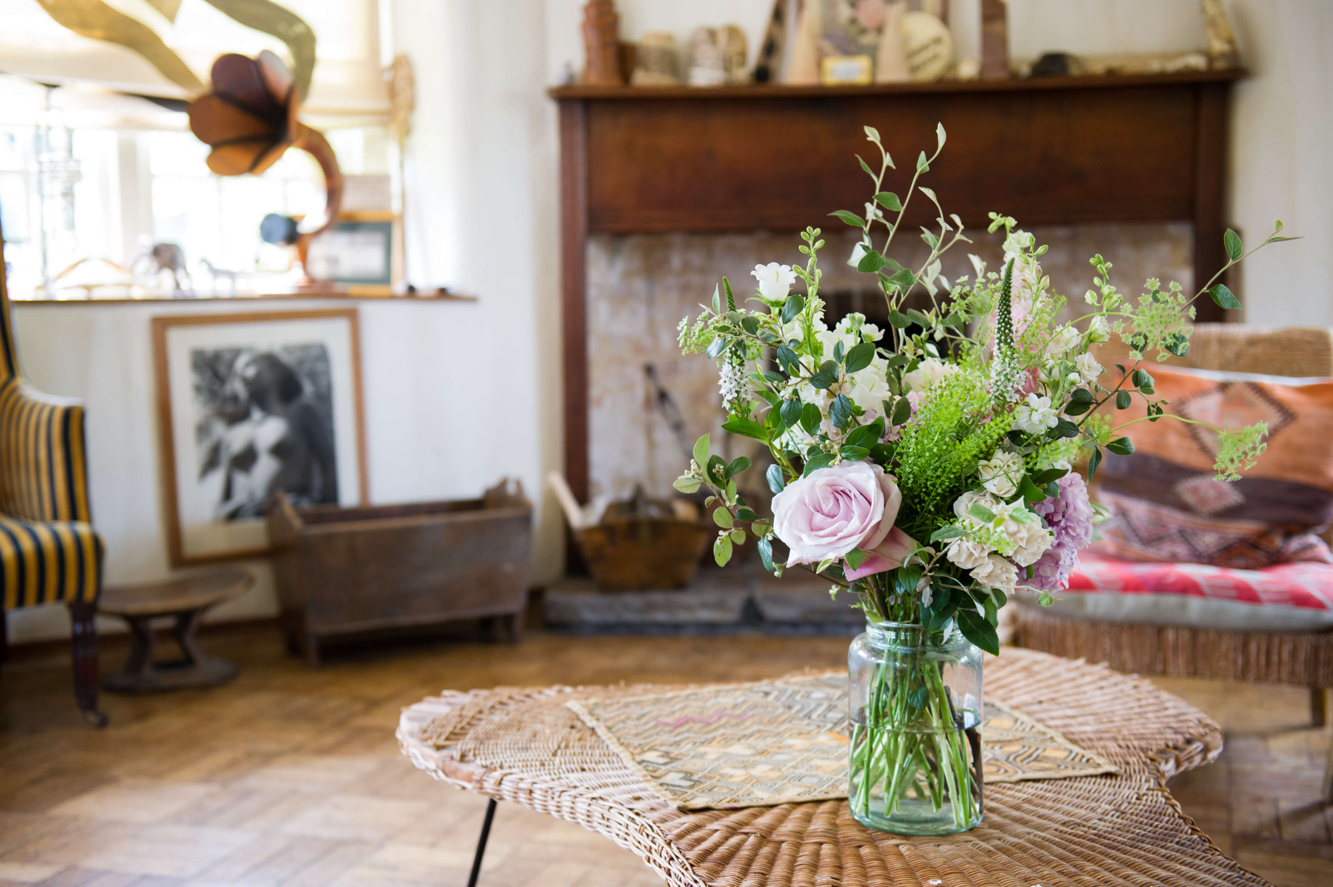 A photo of florals in a vase on the table at Voewood